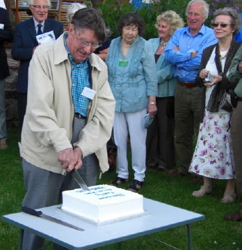 Jack Blencowe cutting cake